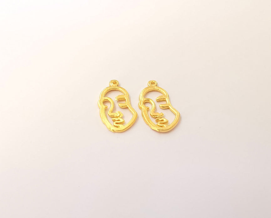 4 Face Charms Gold plated brass charms (19x11mm)  G23812