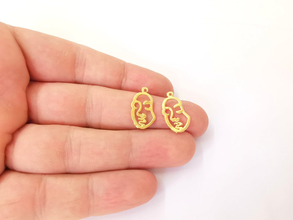 4 Face Charms Gold plated brass charms (19x11mm)  G23812