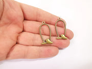 4 Bird charms Antique bronze plated charms (34x17mm) G23932