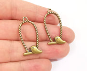 4 Bird charms Antique bronze plated charms (34x17mm) G23932
