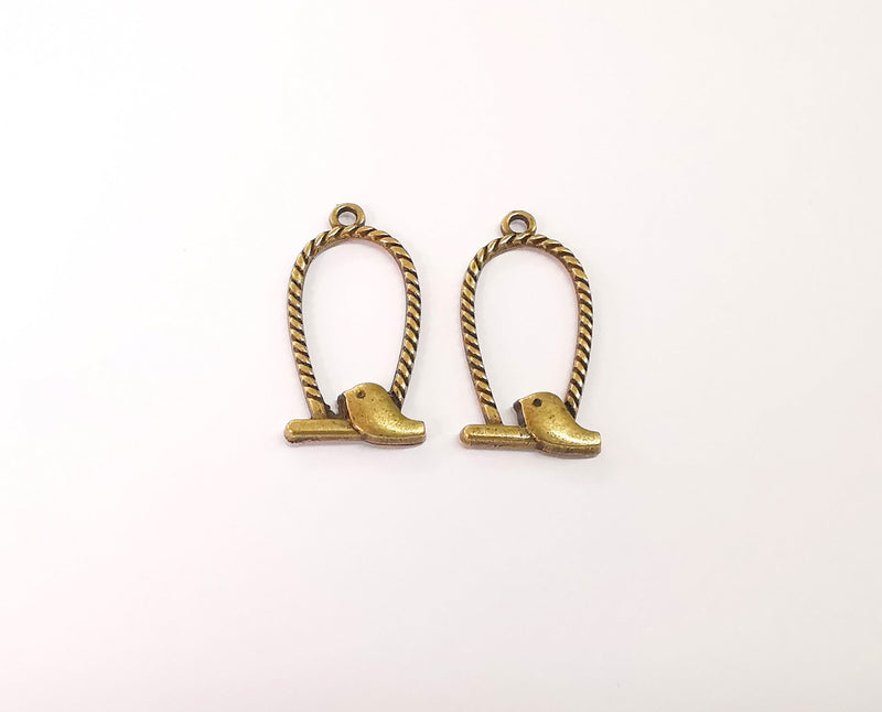 4 Bird charms Antique bronze plated charms (34x17mm) G23932
