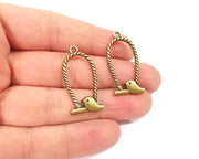4 Bird charms Antique bronze plated charms (34x17mm) G23932