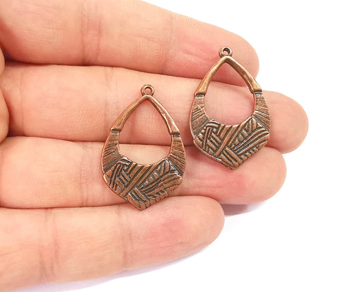 4 Antique copper charms Antique copper plated charms (32x21mm)  G23941