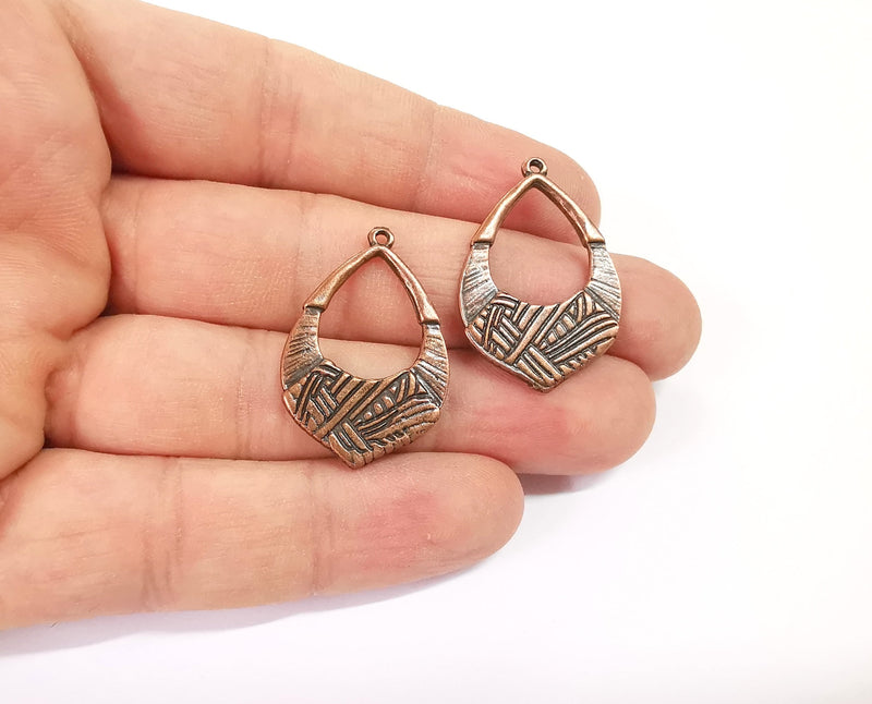 4 Antique copper charms Antique copper plated charms (32x21mm)  G23941