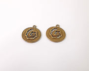 4 Spiral charms Antique bronze plated charms (23x20mm) G23954