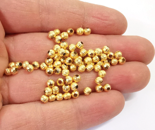 20 Ribbed beads Gold plated beads (4mm) G24437